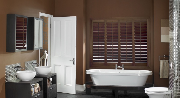 Stained wood shutter in Sacramento bathroom